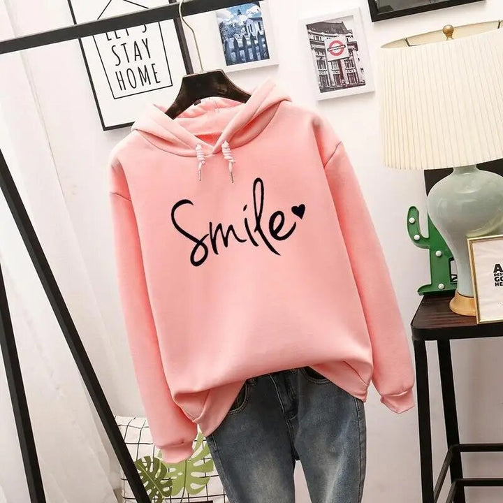 Bellamy graphic print drawstring hooded sweatshirt in pink, front view on hanger
