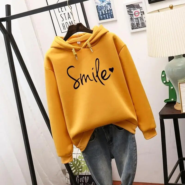 Bellamy graphic print drawstring hooded sweatshirt in yellow, front view on hanger