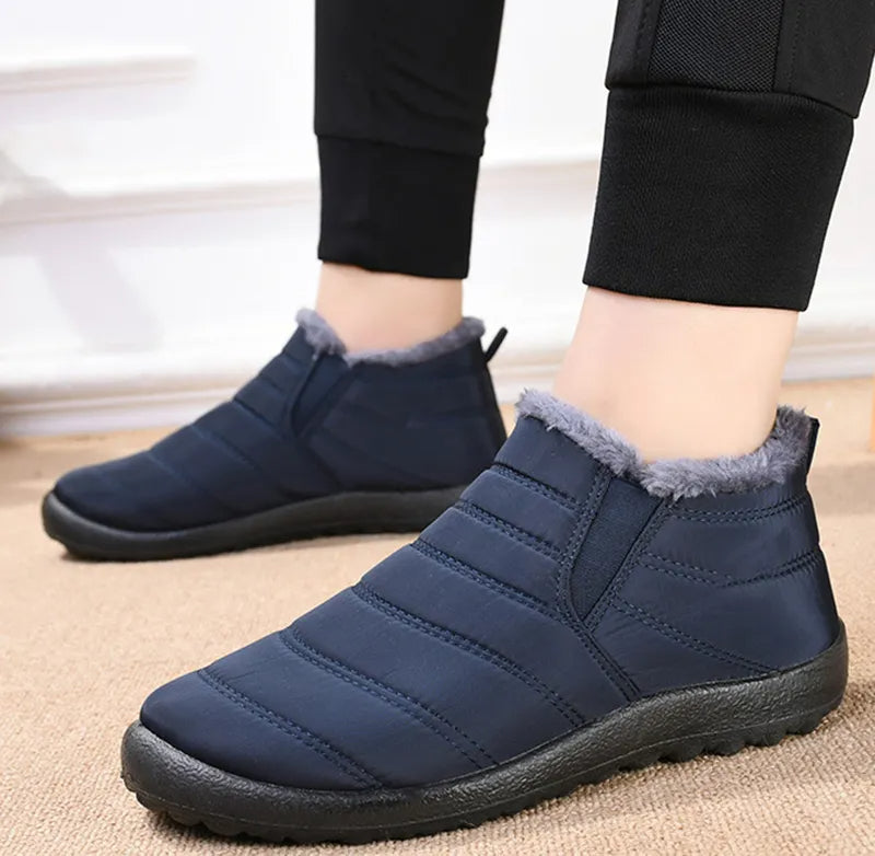 Callum navy ankle snow boots worn on model, standing pose