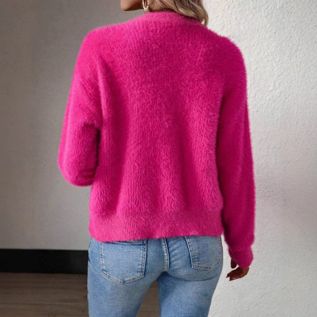 Coraline fuzzy V-neck cardigan, holding coffee cup
