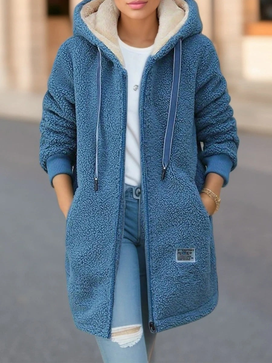 Delphine hooded zip up teddy coat in blue, front view with hands in pockets