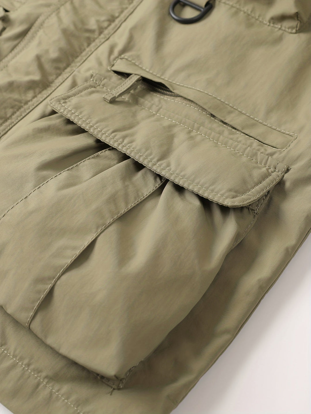 Close-up of Emerson cargo jacket lower flap pocket and pleated storage detail