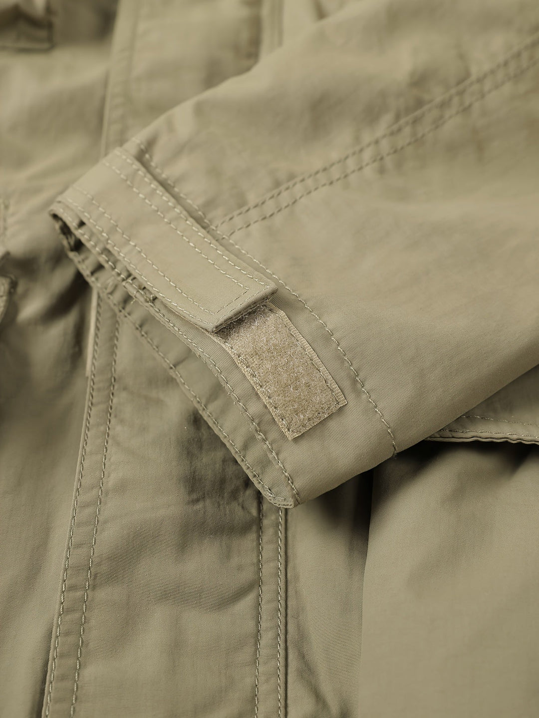 Close-up of Emerson cargo jacket sleeve cuff with hook-and-loop closure