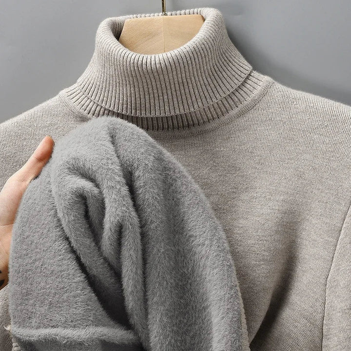 Emiliano heather grey turtleneck sweater displayed on mannequin with fabric texture