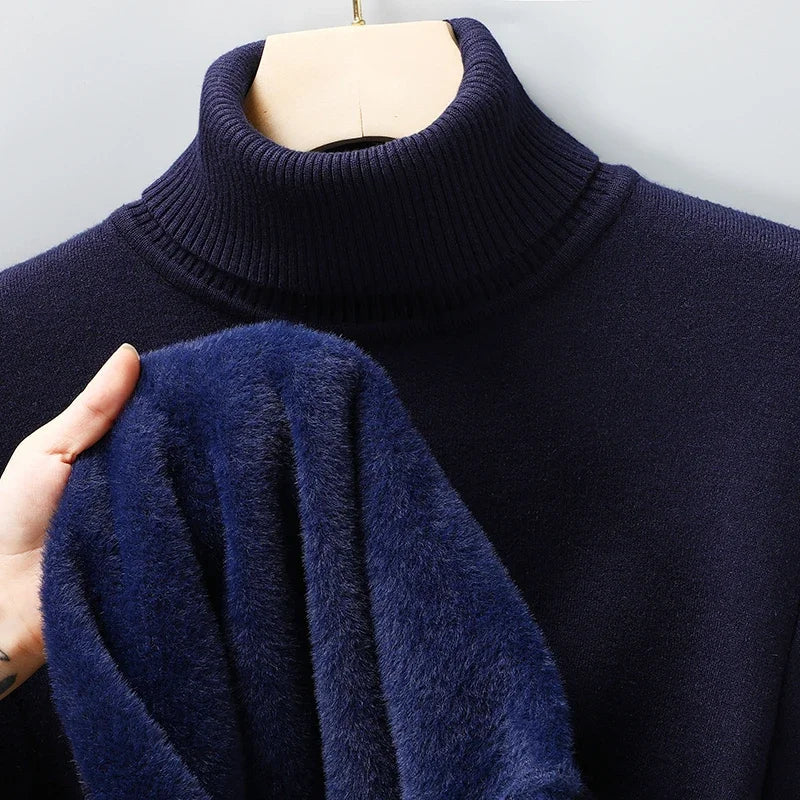 Emiliano navy turtleneck sweater displayed on mannequin with fabric texture