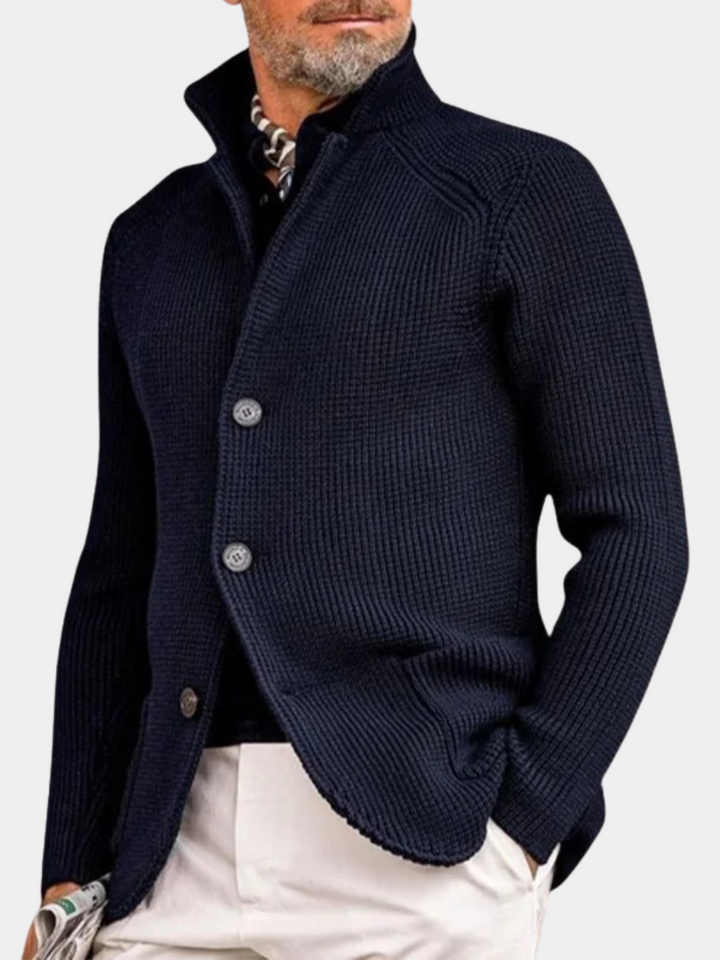 Man wearing navy stand collar button front knit cardigan, front view close-up