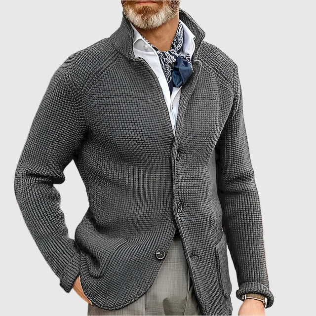 Man wearing dark grey stand collar button front knit cardigan, close-up