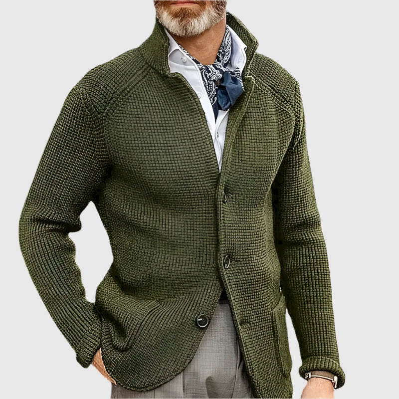 Man wearing olive green stand collar button front knit cardigan, close-up