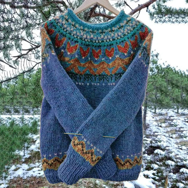 Freya blue Fair Isle knit sweater with patterned yoke, hanging outdoors front view