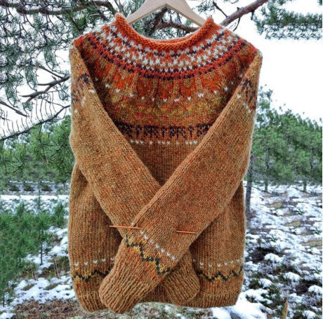 Freya brown Fair Isle knit sweater with patterned yoke, hanging outdoors front view