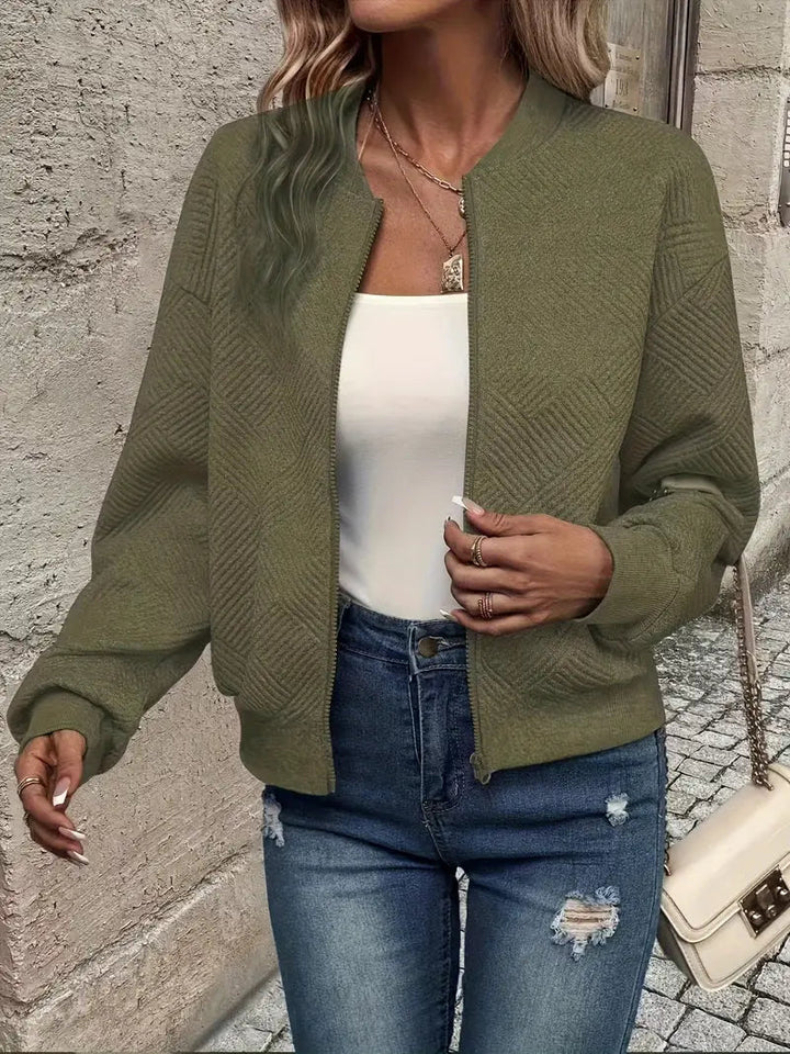 Genevieve textured zip-up bomber jacket in white, styled with jeans and handbag