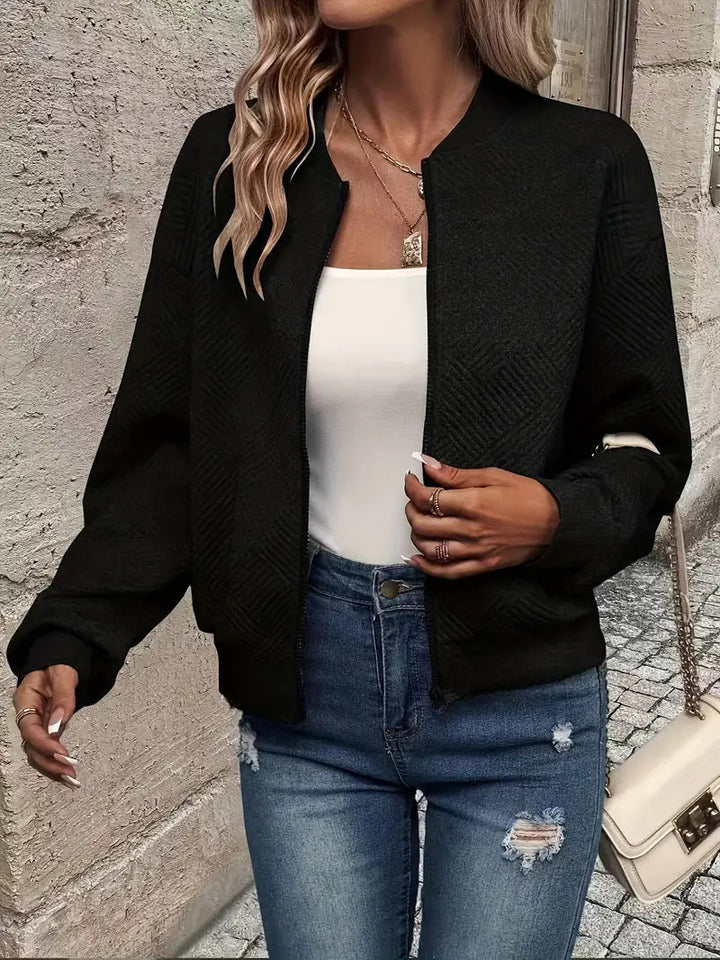 Genevieve textured zip-up bomber jacket in white, styled with jeans and handbag