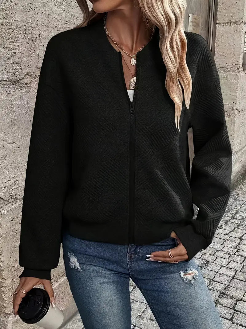 Genevieve textured zip-up bomber jacket in white, styled with jeans and handbag