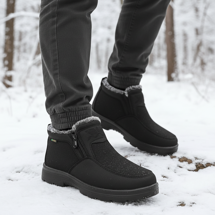 Griffin waterproof snow boots on model walking in snowy forest