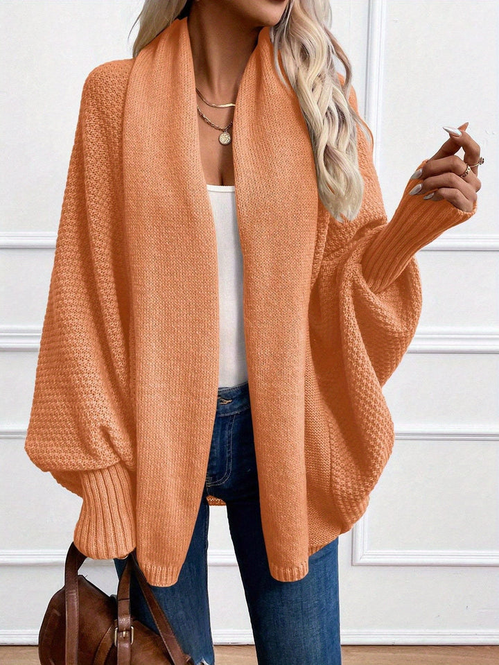 Guinevere draped shawl collar cardigan in apricot, front view