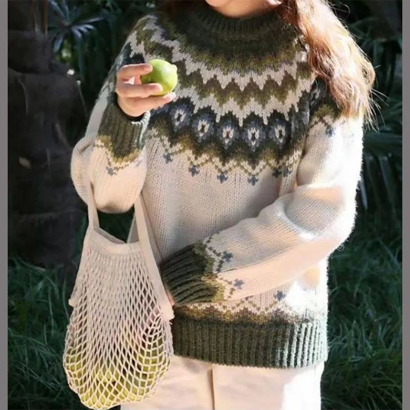 Isadora Fair Isle crew neck sweater in green and cream, front view with model holding a lime