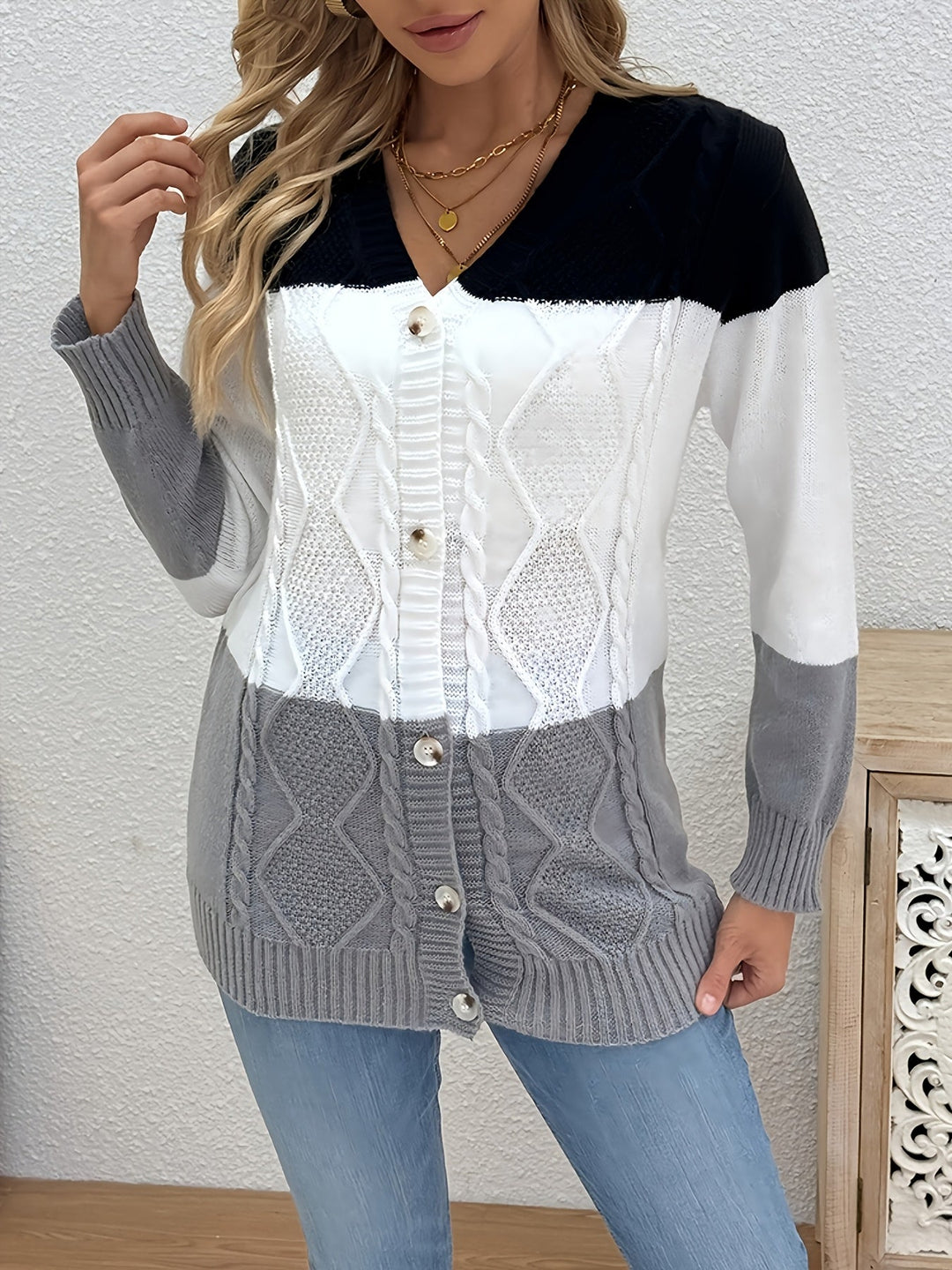 Josephine colorblock cable knit cardigan in pink and black, front view