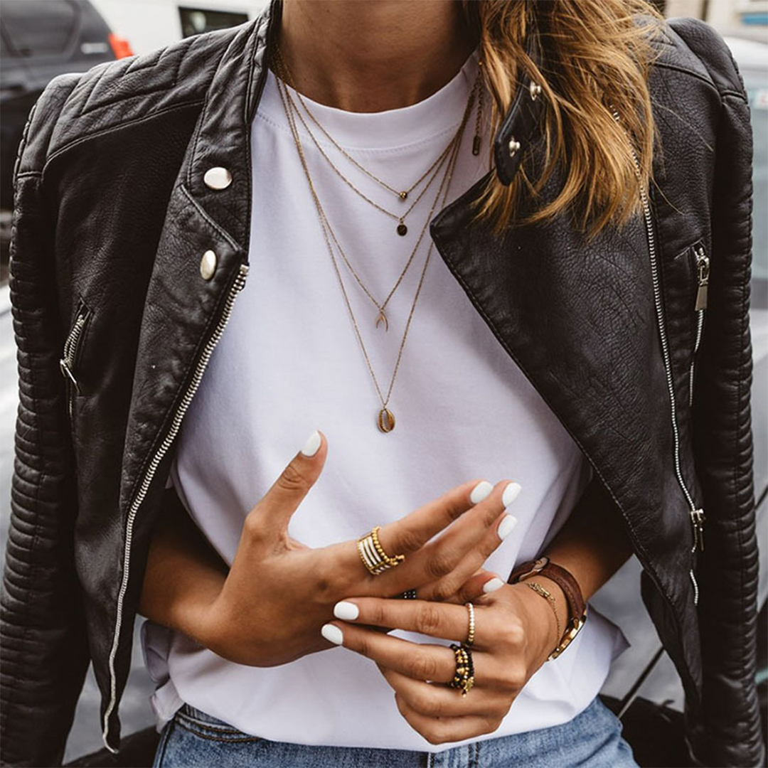 Josephine quilted faux leather moto jacket, layered necklaces close-up front view