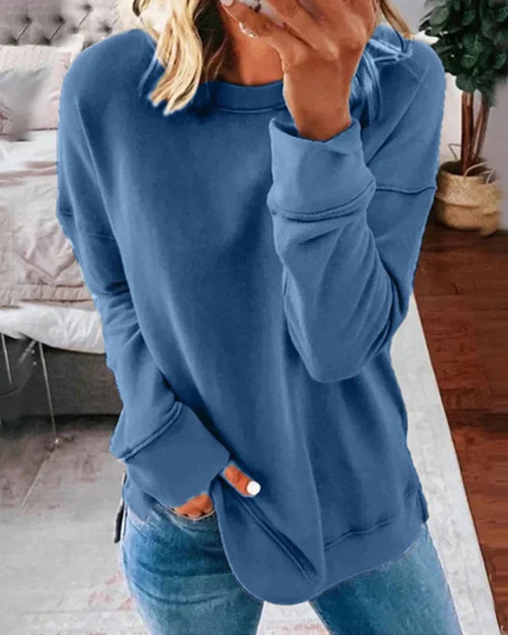 Josephine blue crew neck sweater with thumbhole cuffs, front view