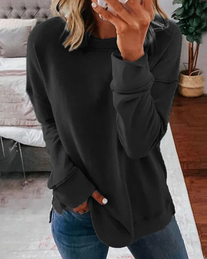 Josephine black crew neck sweater with thumbhole cuffs, front view