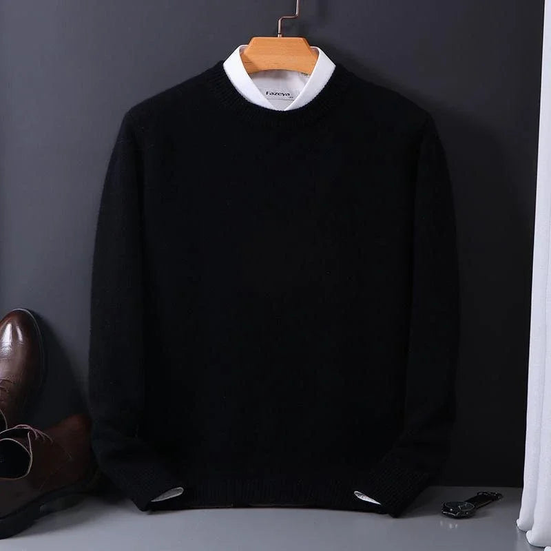Julian black mock neck cashmere sweater on hanger, styled with dress shoes