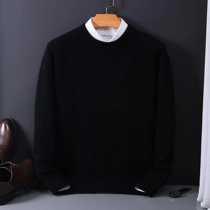 Julian black mock neck cashmere sweater on hanger, styled with dress shoes