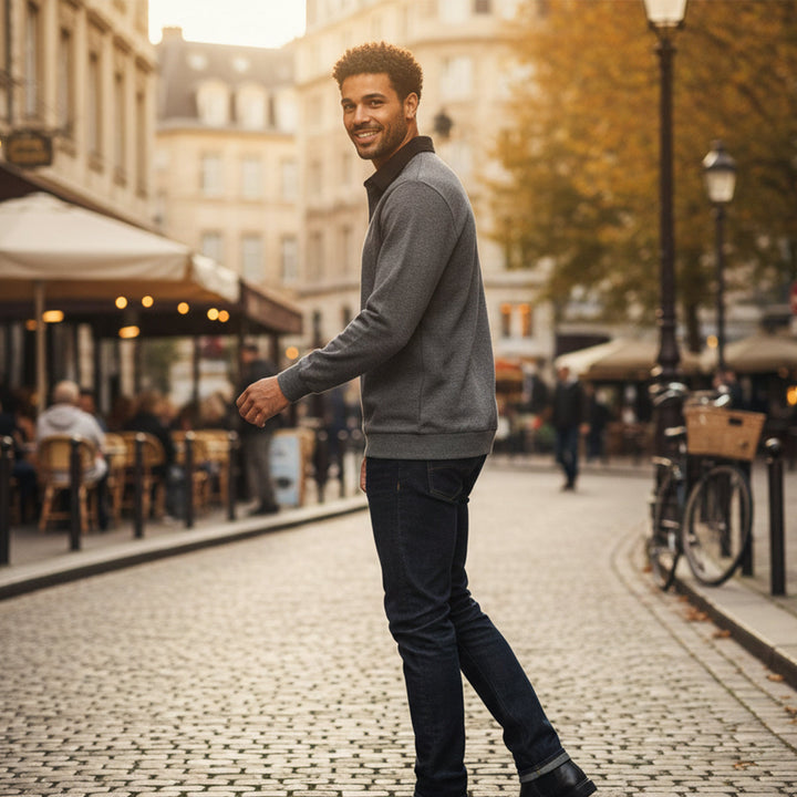 Lachlan gray polo styled with jeans, side view on cobblestone street
