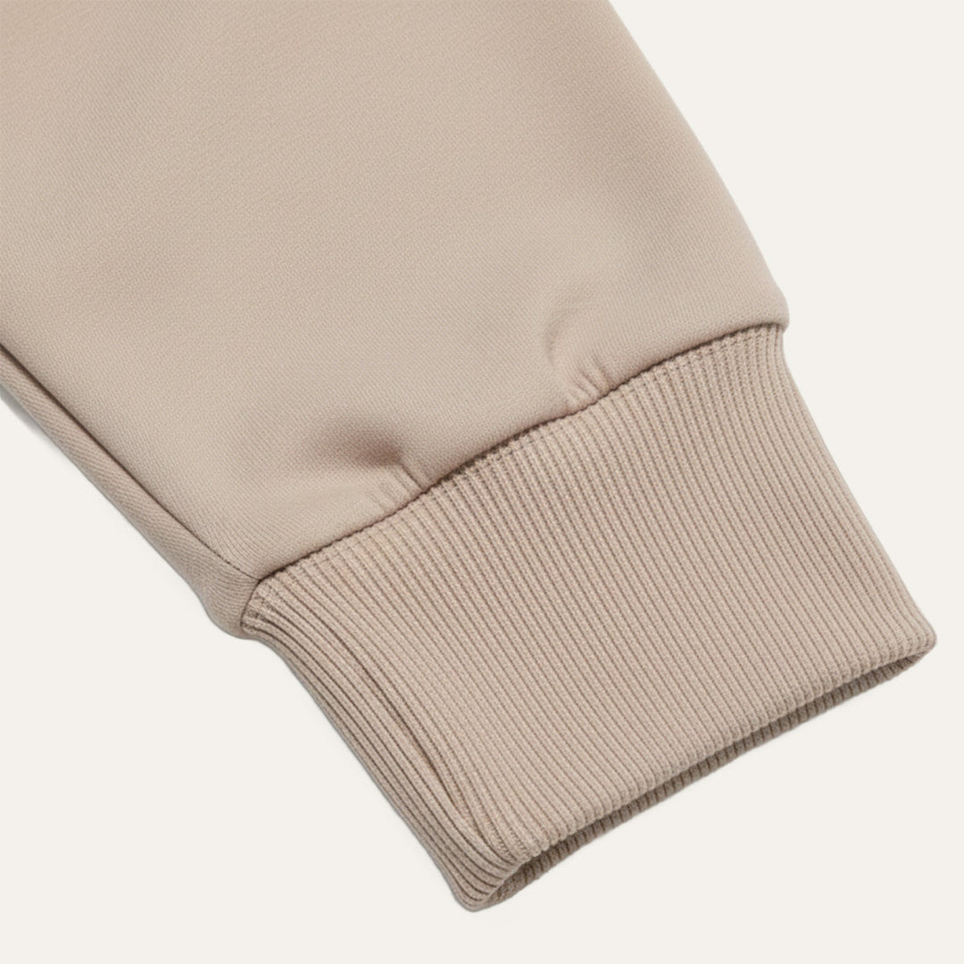 Close-up of ribbed cuff detail on Lachlan long sleeve polo