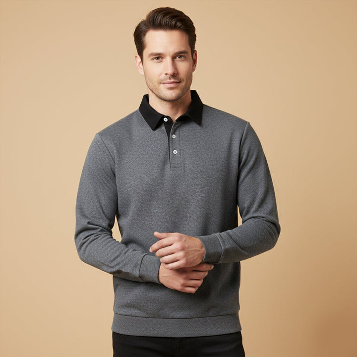 Lachlan dark gray polo worn by model with black pants