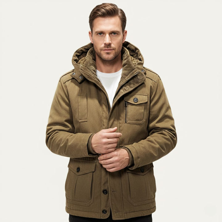 Man wearing Landon khaki hooded parka with front pockets buttoned up