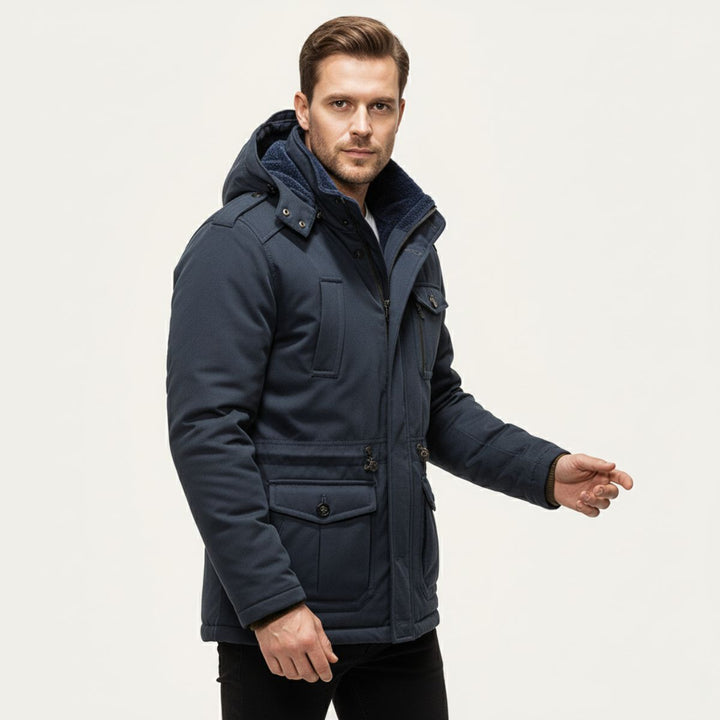 Man wearing Landon navy blue parka jacket, side angle
