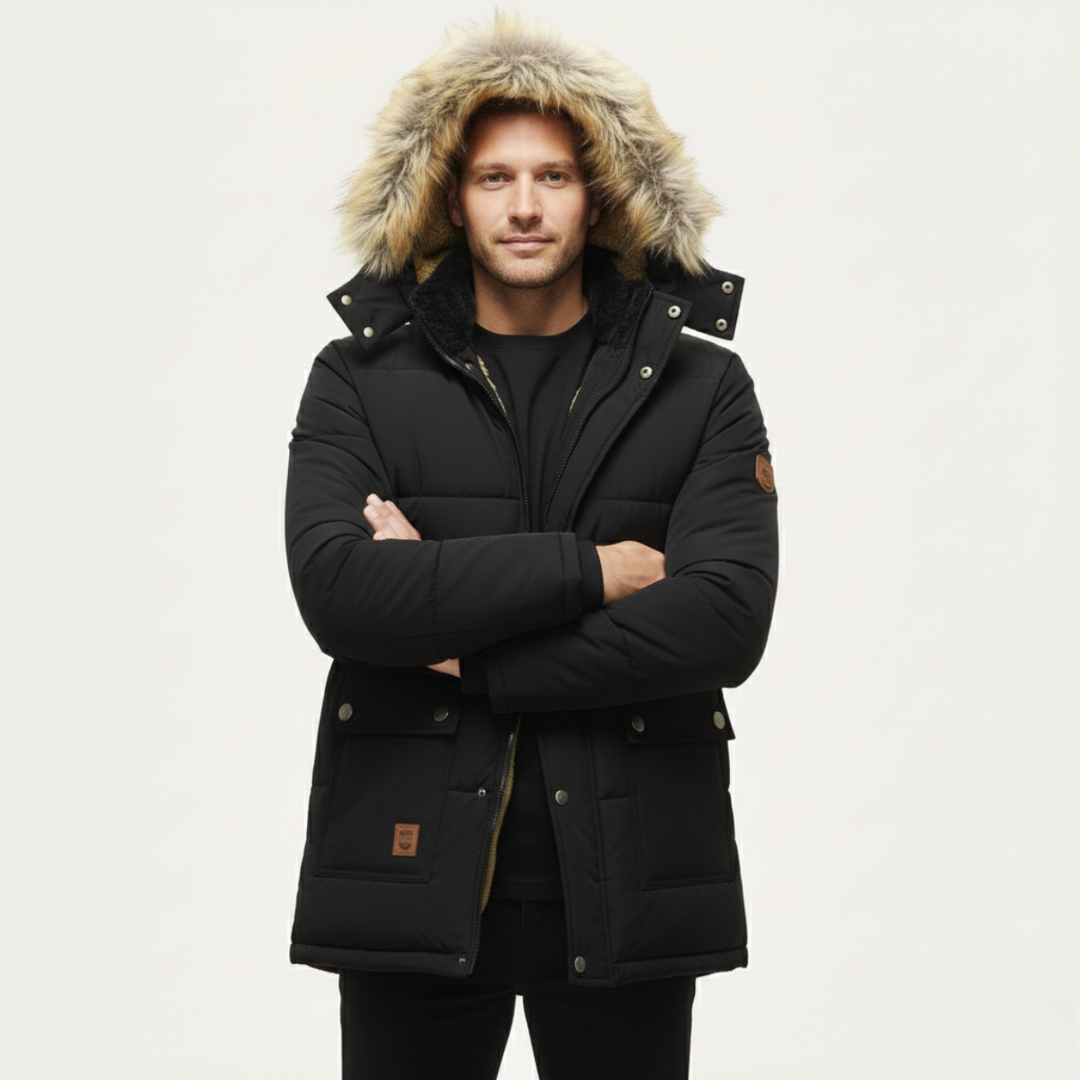 Marcus black hooded parka with faux fur trim, front view worn by model with arms crossed