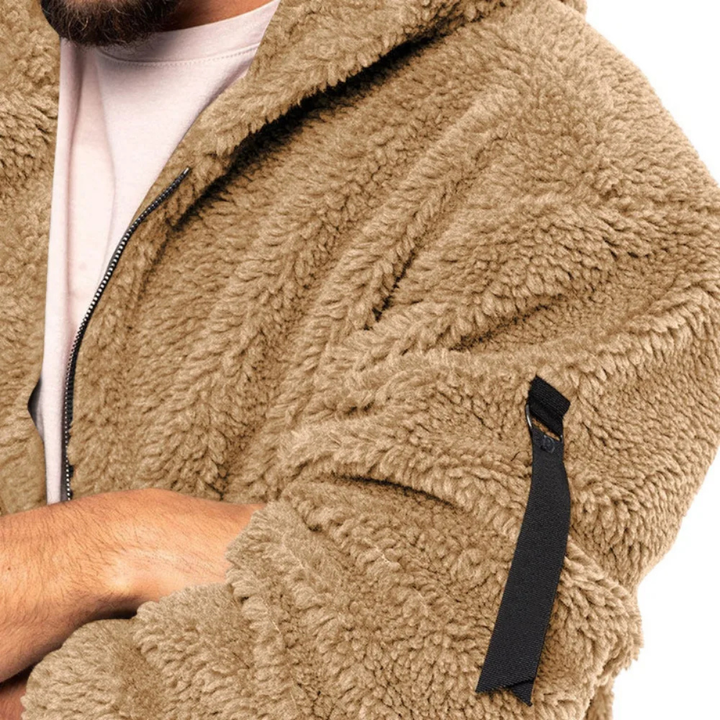 Close-up of Marcus fleece jacket zippered sleeve pocket detail