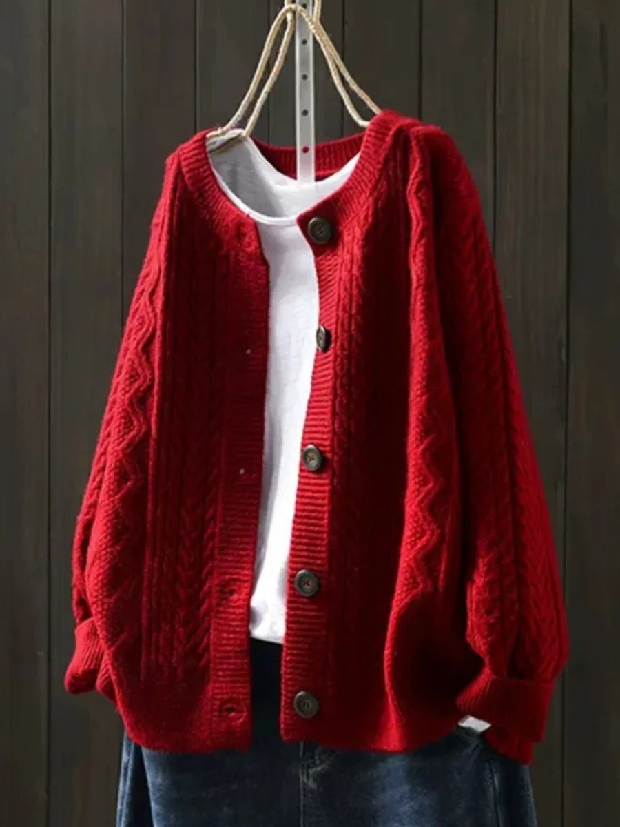 Marguerite oversized cable knit cardigan in red, front view on hanger