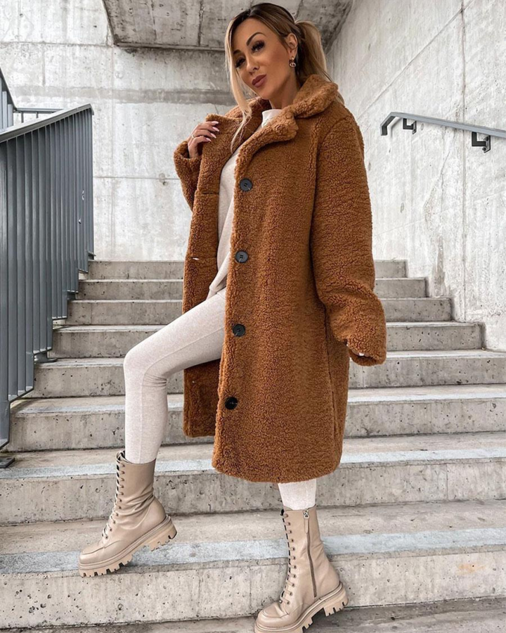 Marisol longline teddy coat in brown, front view on stairs