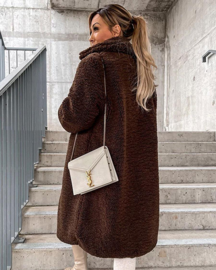 Marisol teddy coat in dark brown, back view with crossbody bag