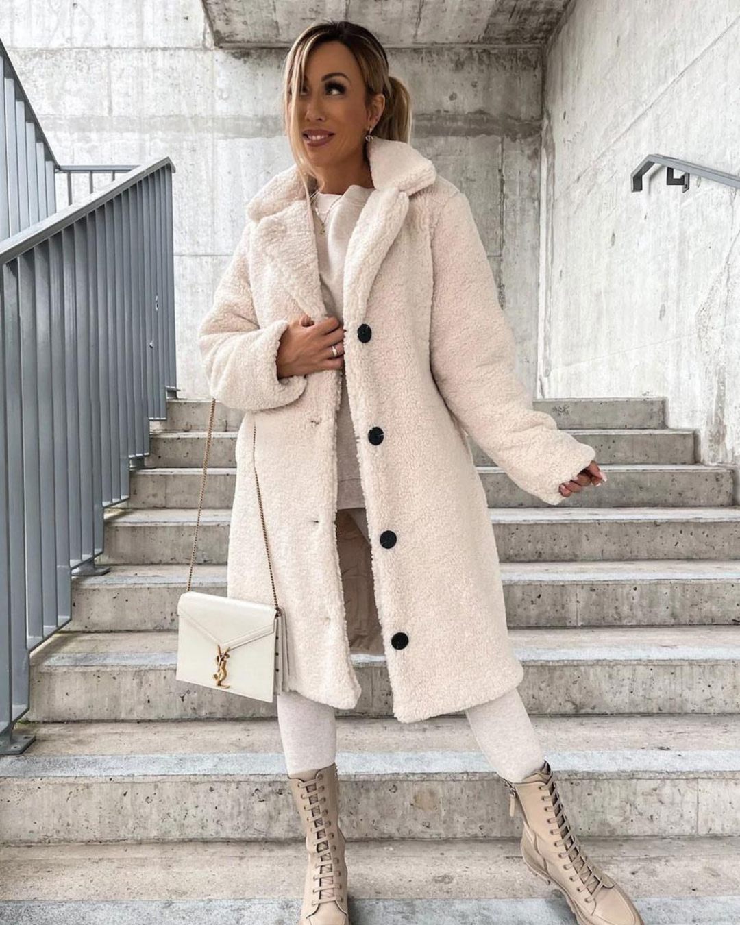 Marisol teddy coat in dark brown, back view with crossbody bag