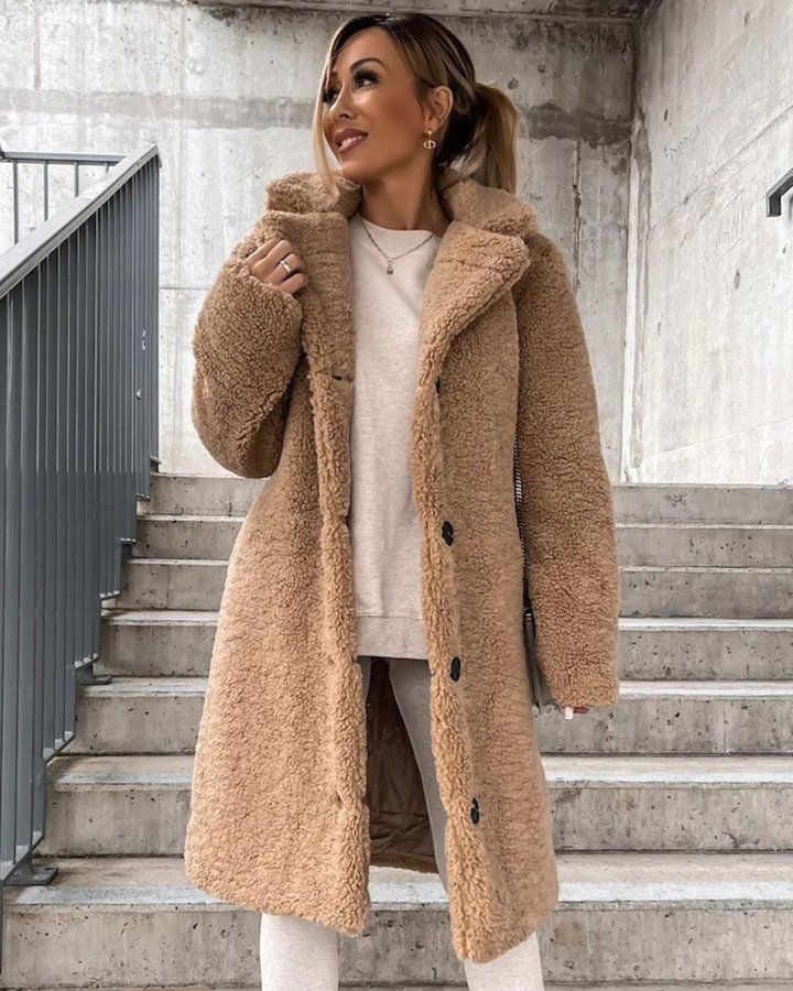 Marisol teddy coat in dark brown, back view with crossbody bag