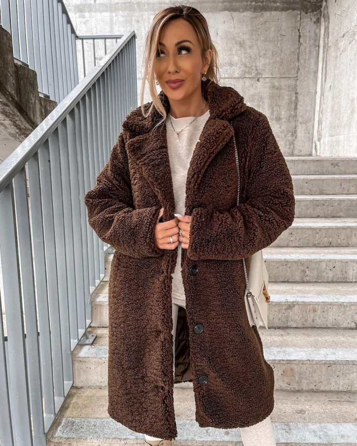 Marisol teddy coat in dark brown, back view with crossbody bag