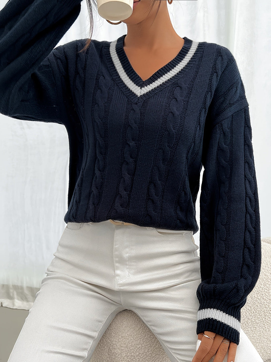 Marlowe V-neck sweater styled with white pants, front view