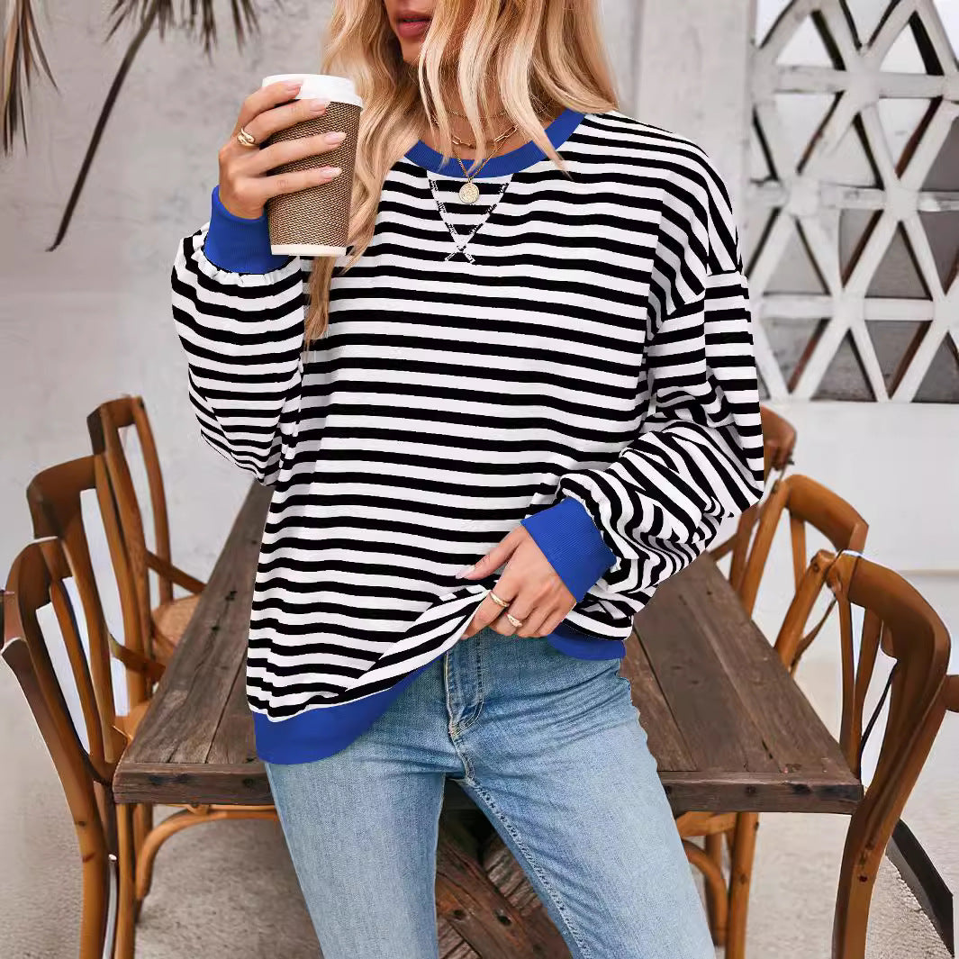 Priscilla blue and white striped sweater, lifestyle shot with coffee cup