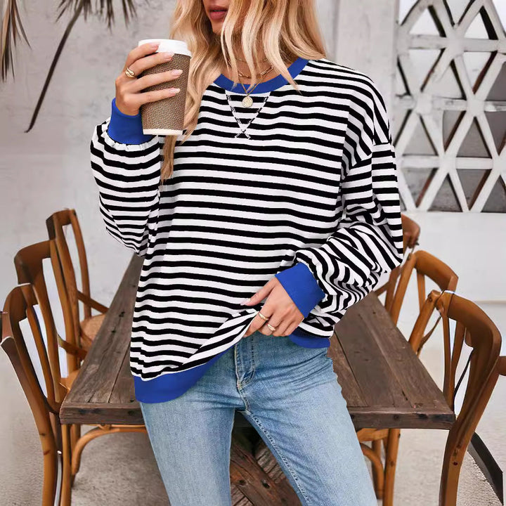 Priscilla blue and white striped sweater, lifestyle shot with coffee cup