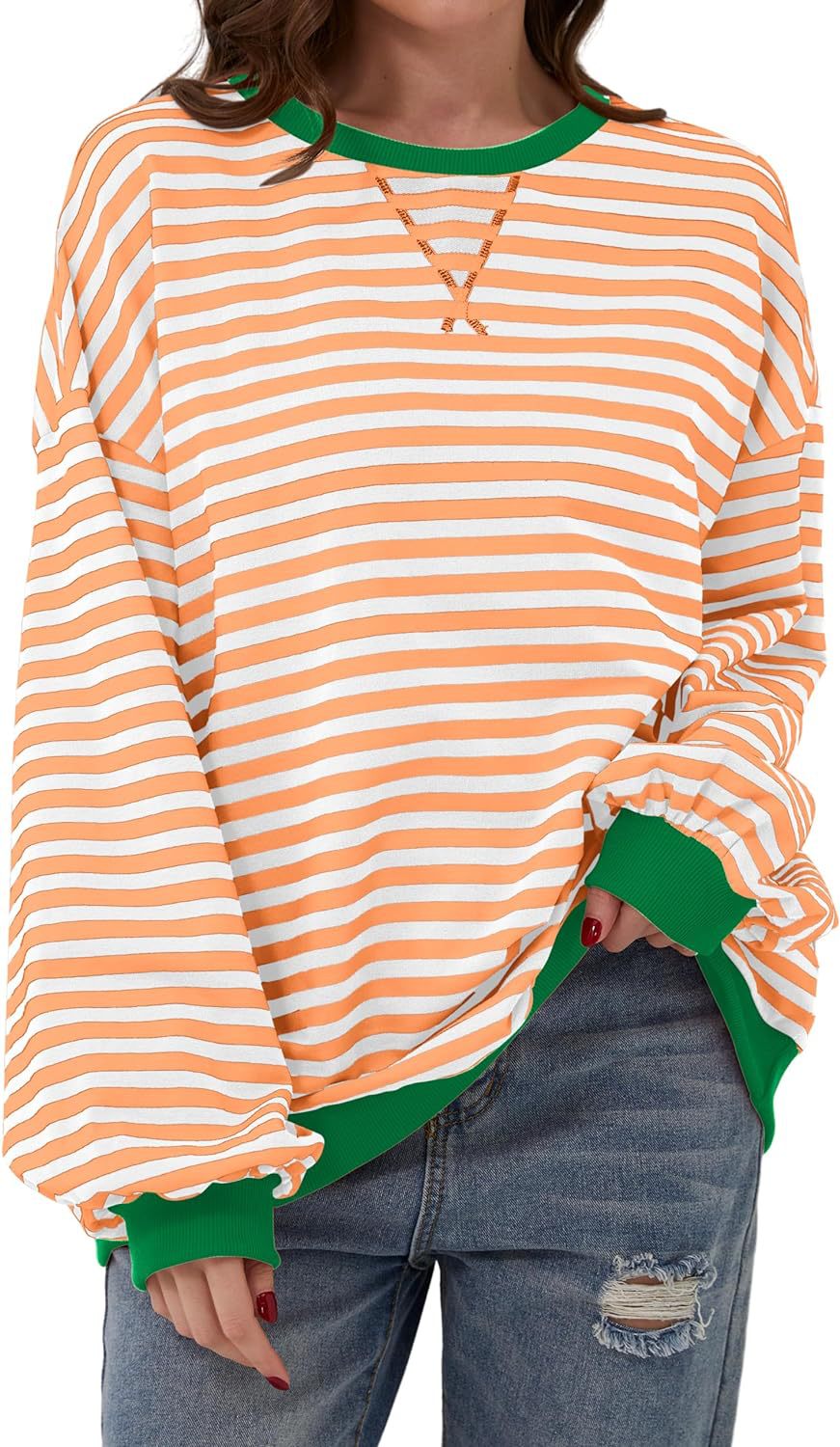 Priscilla orange and blue striped oversized sweater, close-up front view