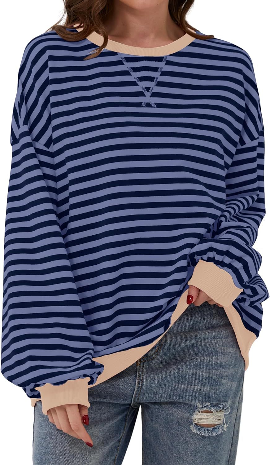 Priscilla orange and white striped oversized sweater, close-up front view