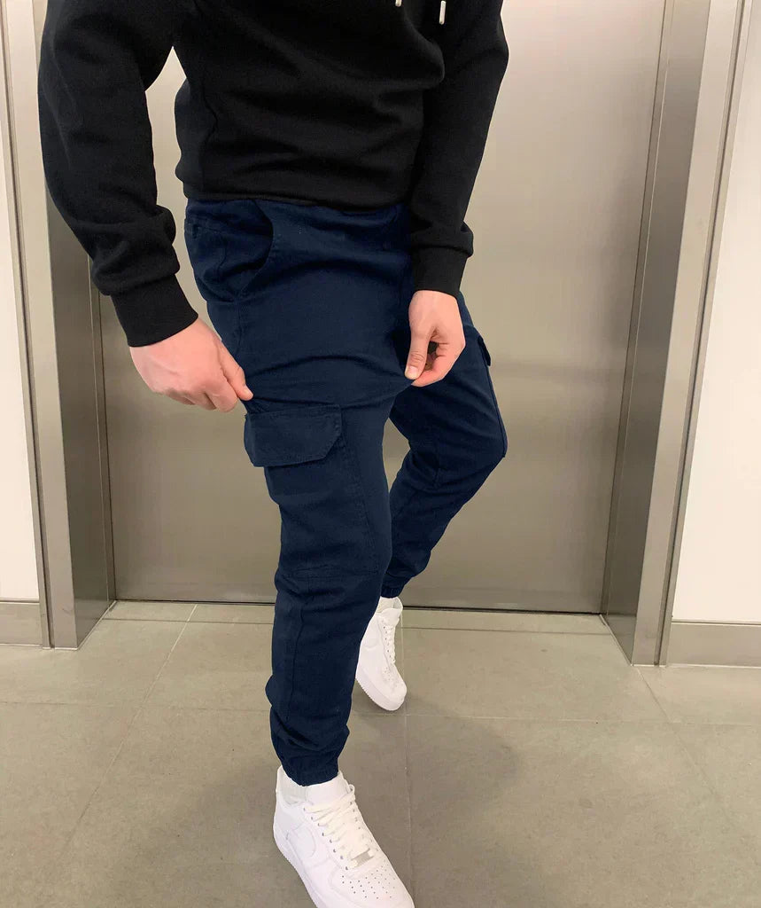 Ronan navy cargo jogger pants, close-up side view with pocket detail