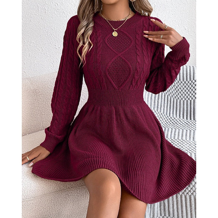 Rosalie cable-knit sweater dress, front view with hand near collar