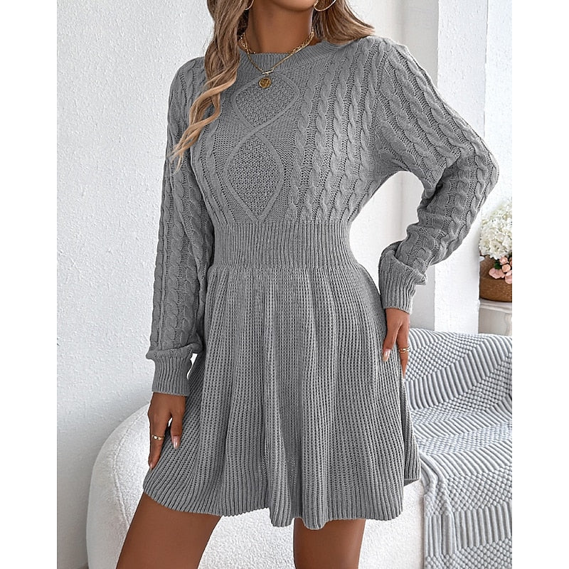 Rosalie cable-knit sweater dress, front view with hand on hip