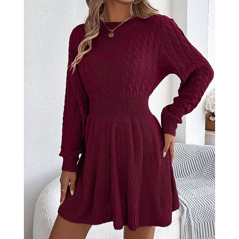Rosalie cable-knit sweater dress, front view with hand near collar