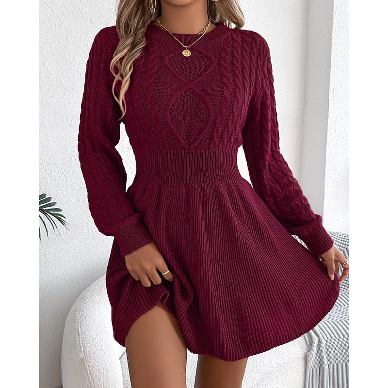 Rosalie cable-knit sweater dress, front view with hand near collar
