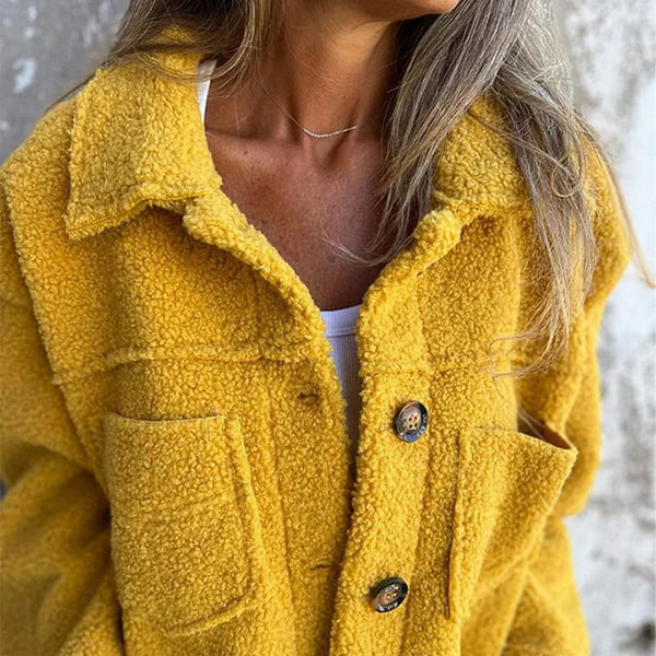 Rosalinde teddy coat close-up of lapel collar and button front, yellow